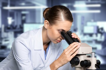 Young smart scientist work with microscope for research