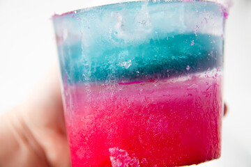 Colorful ice painted by watercolor paints. Winter kid's activities.
