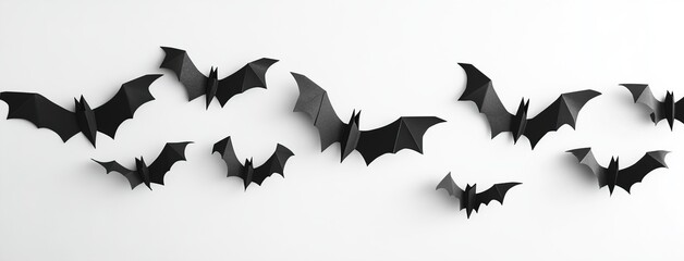 Naklejka premium Halloween background. Black paper bats on white background. Halloween concept