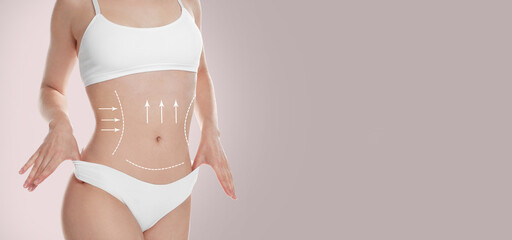 Woman with perfect slim body on dusty pink background, closeup. Figure correction arrows and lines...