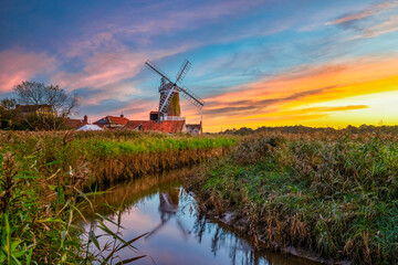 Cley Windmill at sunset in the village of Cley, Norfolk, UK
