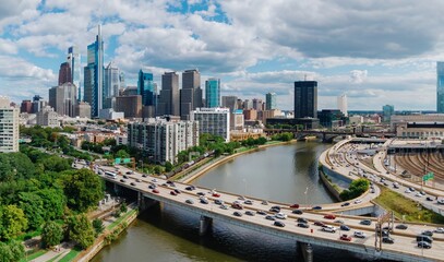 Traffic on the Vine St Expressway crossing the Schuylkill River and the downtown city skyline of...