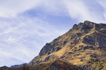The Majestic Mountain Landscape Is Beautifully Framed Under a Bright Blue Sky Above