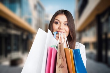 Portrait of happy woman posing with shopping bags