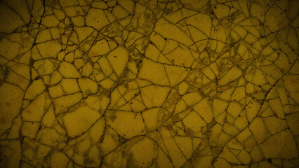 Obraz premium Vintage cracked stone texture with golden yellow and earthy beige tones, ideal for creating warm and rustic wallpapers, banners, and design templates