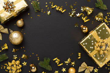 Christmas decor, gift boxes and confetti on color background, top view. Copy space for design