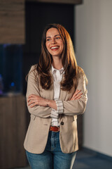 Corporate photo of smiling businesswoman posing at enterprise office.