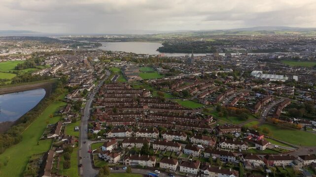 City of Derry aka Londonderry in Northern Ireland aerial view - A Beautiful Cityscape from above by the River Foyle Featuring the Beautiful Pedestrian Peace Bridge