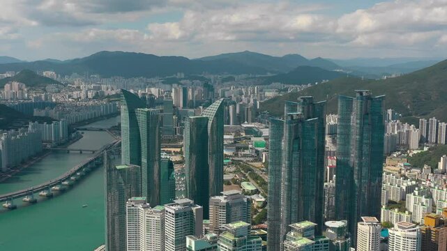 BUSAN, SOUTH KOREA - OCTOBER 19, 2024: Aerial view of Busan skyline showcasing modern architecture and vibrant city life along the coast