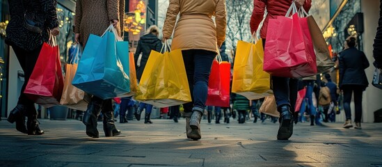 Shoppers carrying large bags filled with Black Friday deals, capturing the excitement the day