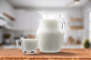 Delicious fresh protein shake on desk in glass
