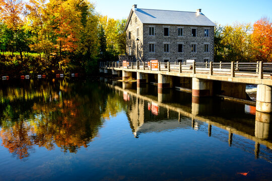 Watson's Mill an historic flour and gristmill built of quarried limestone in Manotick, Ontario, on the Rideau canal outside ottawa in fall
