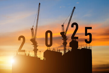 Silhouette of construction camp site with cranes building construction prepare to welcome the new year 2025 at sunset.