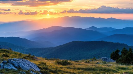 Fototapeta premium Serene Mountain Sunset Over Rolling Hills