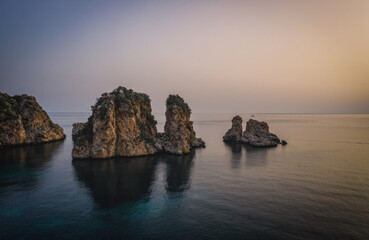 Wonderful Sights of The Stacks and Tonnara of Scopello Faraglioni e Vecchia Tonnara di Scopello , in Trapani Province, Sicily, Italy. June 2023, sunrise