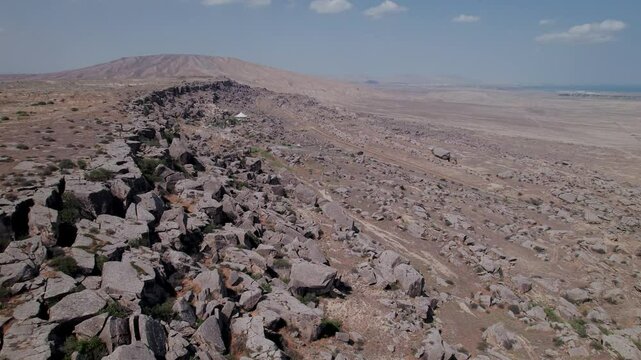 Stunning aerial drone footage of The Gobustan Rock Formations, the Gobustan National Park, UNESCO World Heritage Site, Azerbaijan, Central Asia, Asia