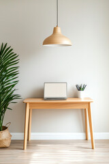 Fototapeta premium Stylish minimalist home office setup featuring a laptop and indoor plants for a productive environment
