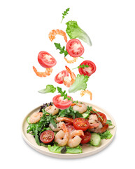 Shrimps and other ingredients falling onto plate on white background