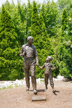 Mt. Airy, NC, USA-June 1, 2024: a Sculpture of the characters of Andy and Opie, father and son in the poputlar Andy Griffith show.