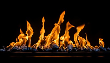 Naklejka premium A flames dancing in a fireplace against a d