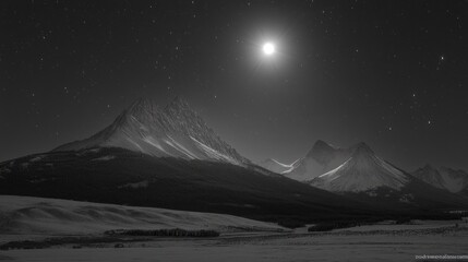 A full moon illuminates snow-capped mountains under a starry night sky.