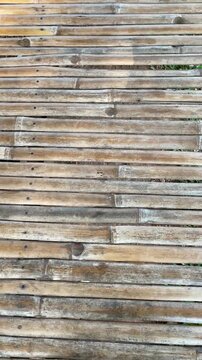 Bamboo slat arrangement background, texture, bamboo slats, upright type. natural brown color. the color of weathered bamboo wood