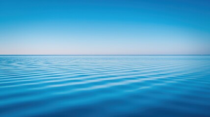 The image is of a calm blue ocean with no visible waves