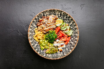 Colorful Buddha bowl with fresh vegetables, quinoa, and avocado, healthy eating and wellness lovers