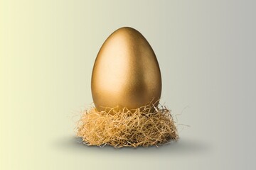 perfect golden chicken egg on desk