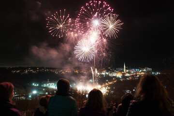 Joyful Celebration with Fireworks Display at Night