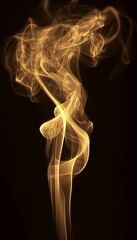Obraz premium Abstract swirls of golden smoke against a black background.