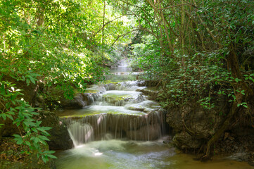 Obraz premium Waterfall and forest at Kanchanaburi, Thailand October 2023