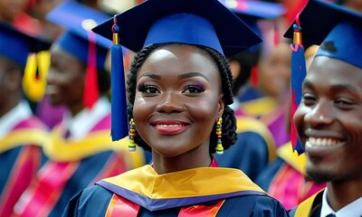 A proud graduate wearing a cap and gown, smiling during a graduation ceremony.