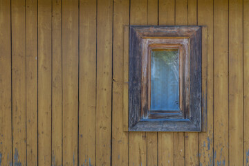 Wooden cotage exterior with small window