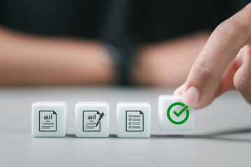 Person arranging wooden blocks with approve document icon for business process workflow...