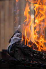 Close up of the hot charcoal glowing and flaming In fireplace . Glowing hot charcoal in barbecue...