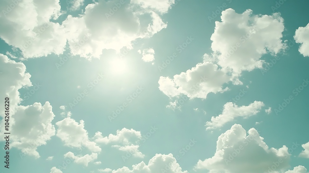 Poster A serene sky with fluffy clouds illuminated by sunlight, creating a tranquil and peaceful atmosphere.