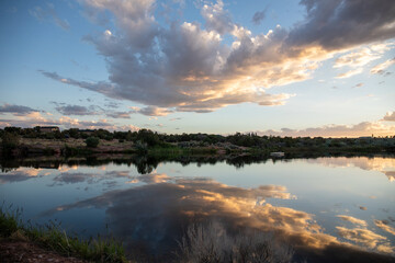 Fototapeta premium Sunset over the river and fantastic clouds in Utah