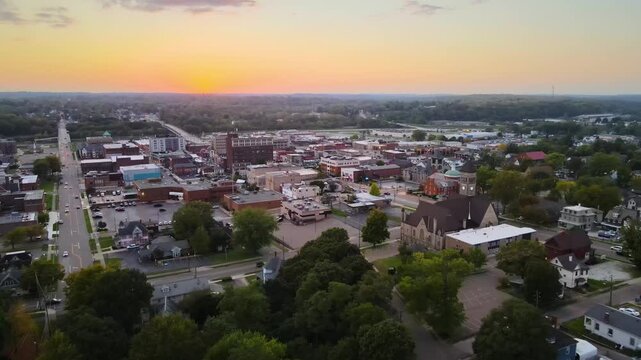 Aerial view of downtown Massillon, Ohio at sunset featuring historic buildings and streets. Dolly Forward Sunset W