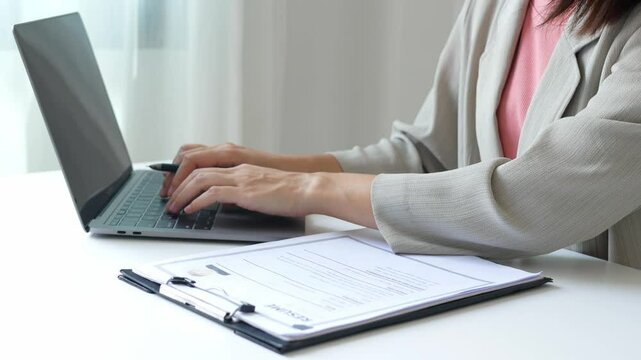 Young businesswoman holds a resume and evaluates it. Views the personal history of job applicants. Recruitment concept