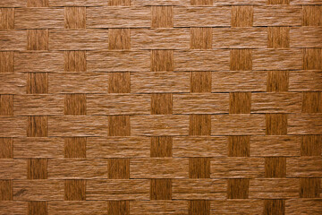 編み込んだ木製の網細工　テクスチャー背景壁紙　かご・織物・自然素材の表面
