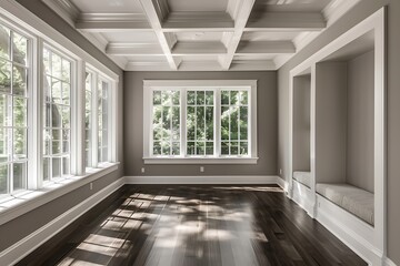 Large sunroom interior with white windows, gray walls, dark wood floors, window seat, white ceiling with long beams, home decor style.