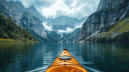 A kayak floating on a serene lake surrounded by towering mountains.
