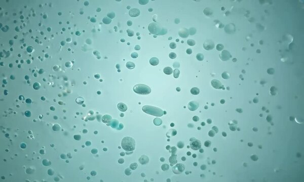 Zoom shot with micro-particle behavior in a solvent gradient: The camera starts with a view of micro-particles in a solvent gradient. The camera zooms in to capture how particles move and interact wit