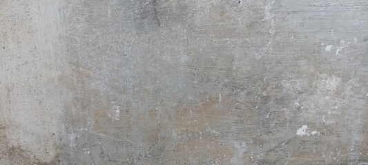 Rough Concrete Wall with Subtle Wear Marks Texture.  An aged, rough concrete wall featuring subtle wear marks, ideal for grunge, urban, or industrial designs