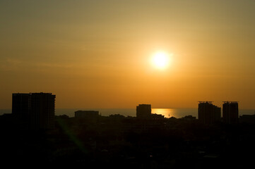 Sunset over the city with a view of the sea