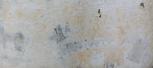 Peeling Paint on Aged Wall with Distressed Texture. A weathered wall with peeling paint and distressed texture, ideal for grunge or vintage designs