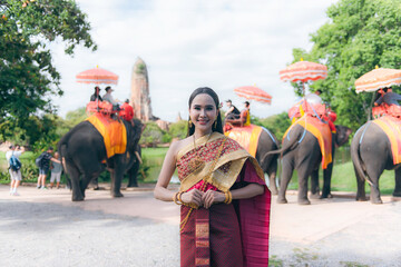 women in traditional clothing on Buddhist on background. Portrait women in traditional clothing , Thai traditional in Ayutthaya, Thailand.