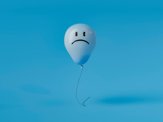 Blue monday concept with sad face balloon floating on blue background