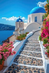 Traditional greek alley leading to white church with blue dome in oia village, santorini island, greece © Lubos Chlubny